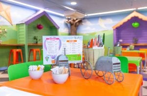 restaurant tables in the soft play area for kids' parents